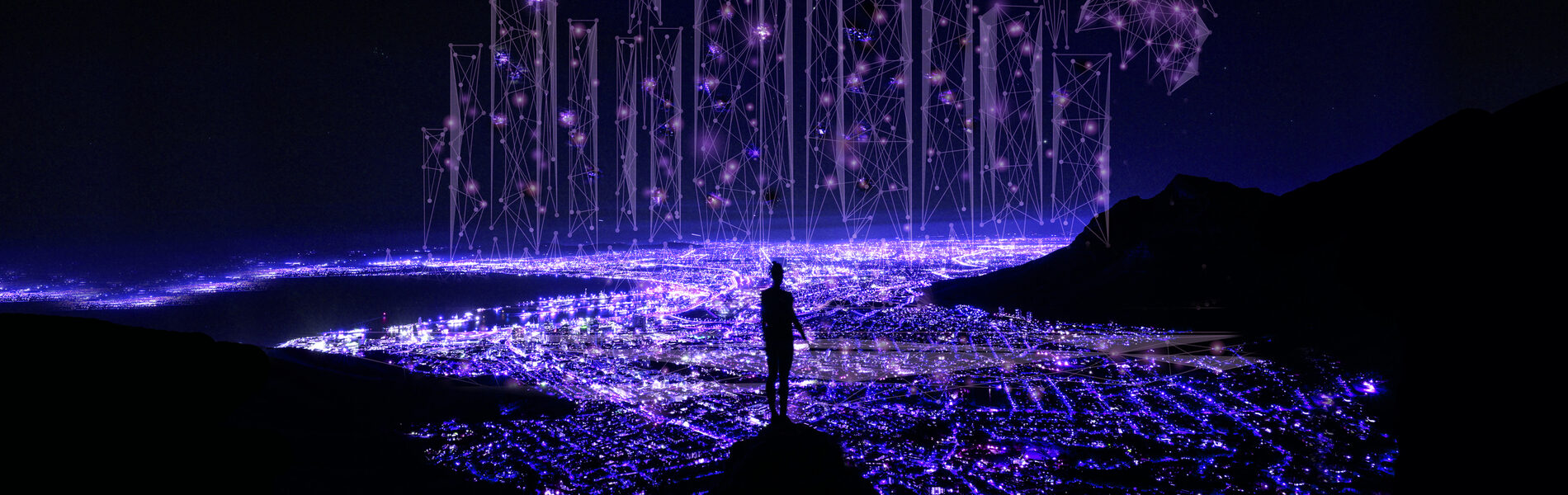 Glowing lights surrounded by darkness with person standing in the middle